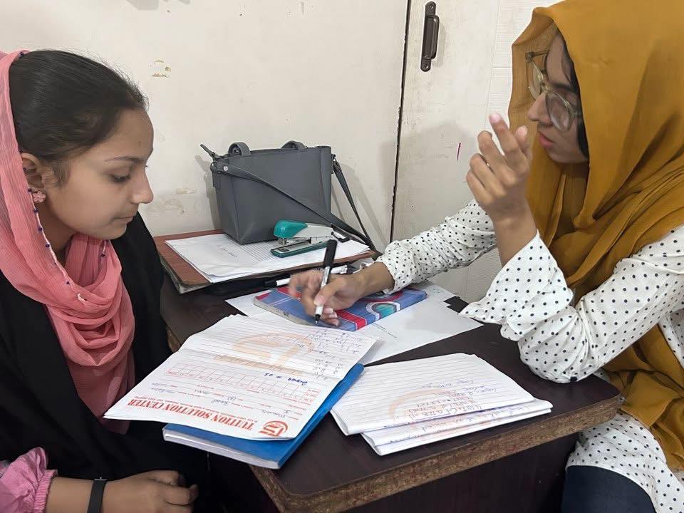 Teacher guiding student